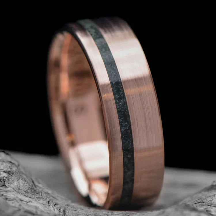 14K rose gold wedding band with moss agate inlay, 6mm mens ring, brushed flat profile, unique custom design, free engraving available, displayed on a white sea branch.