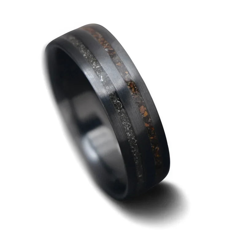 Black titanium wedding band with crushed T-Rex and meteorite inlays, 7mm mens ring on white background, unique mens wedding ring, free engraving available.