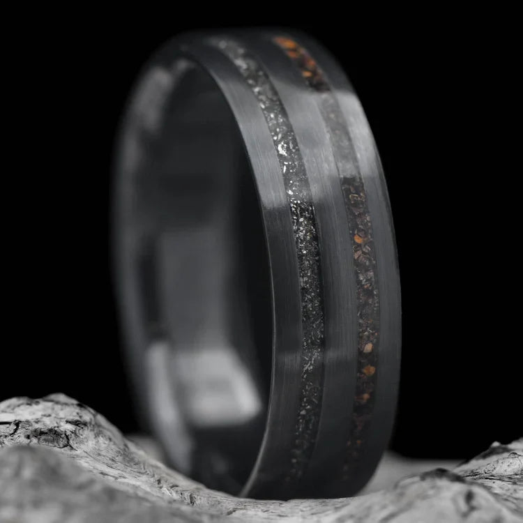 Black titanium wedding band with crushed T-Rex and meteorite inlays, 7mm mens ring on white sea branch, unique design with free engraving.