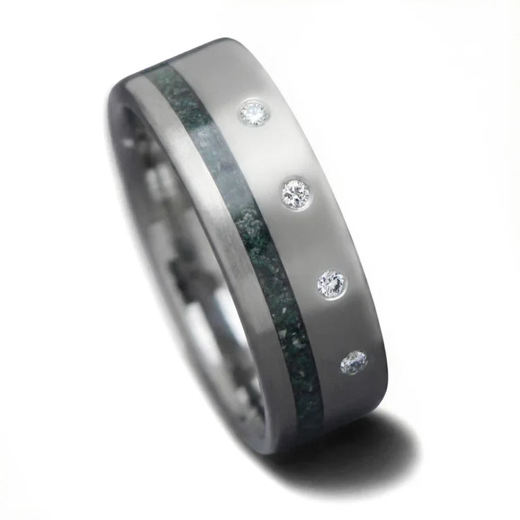 Titanium wedding band featuring a moss agate inlay and flush set diamond, brushed flat profile, 7mm mens wedding ring on a white background, free engraving available.