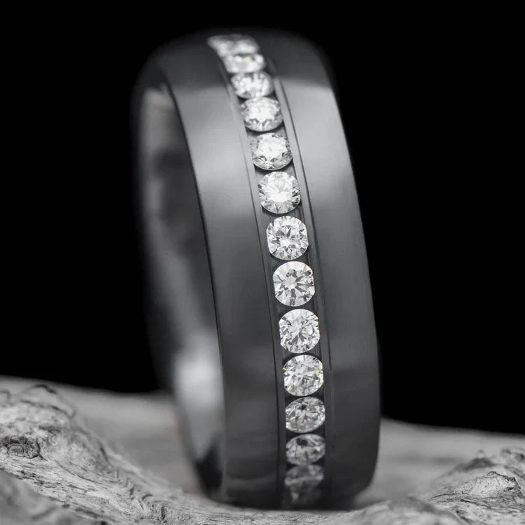 Zirconium wedding band with eternity set precious stone, 6mm mens brushed domed profile ring, free engraving, displayed on white sea branch.