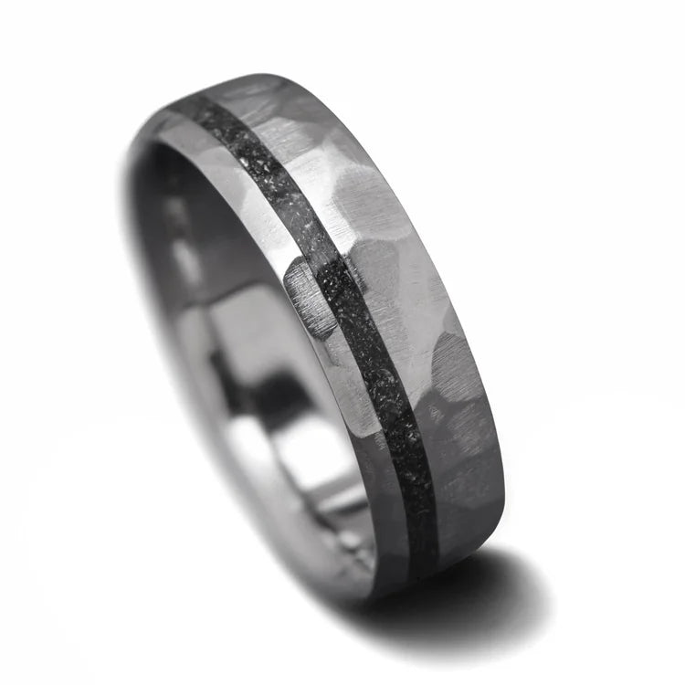 Titanium wedding band with meteorite inlay, 7mm mens ring, unique faceted domed design, free engraving, on white background.