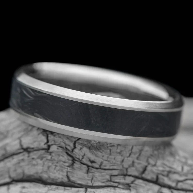 14KW mens wedding band with central forged inlay, brushed flat profile, 6mm width, custom ring with free engraving, displayed on a white sea branch.