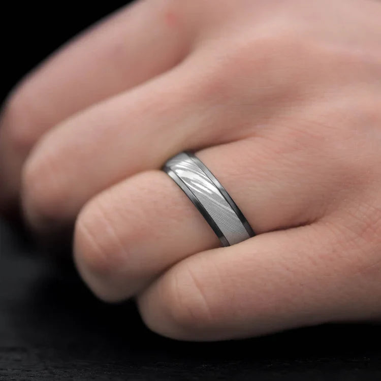 Mens 7mm zirconium wedding ring with central dense twist inlay, polished domed profile, unique design, free engraving, worn on hand.
