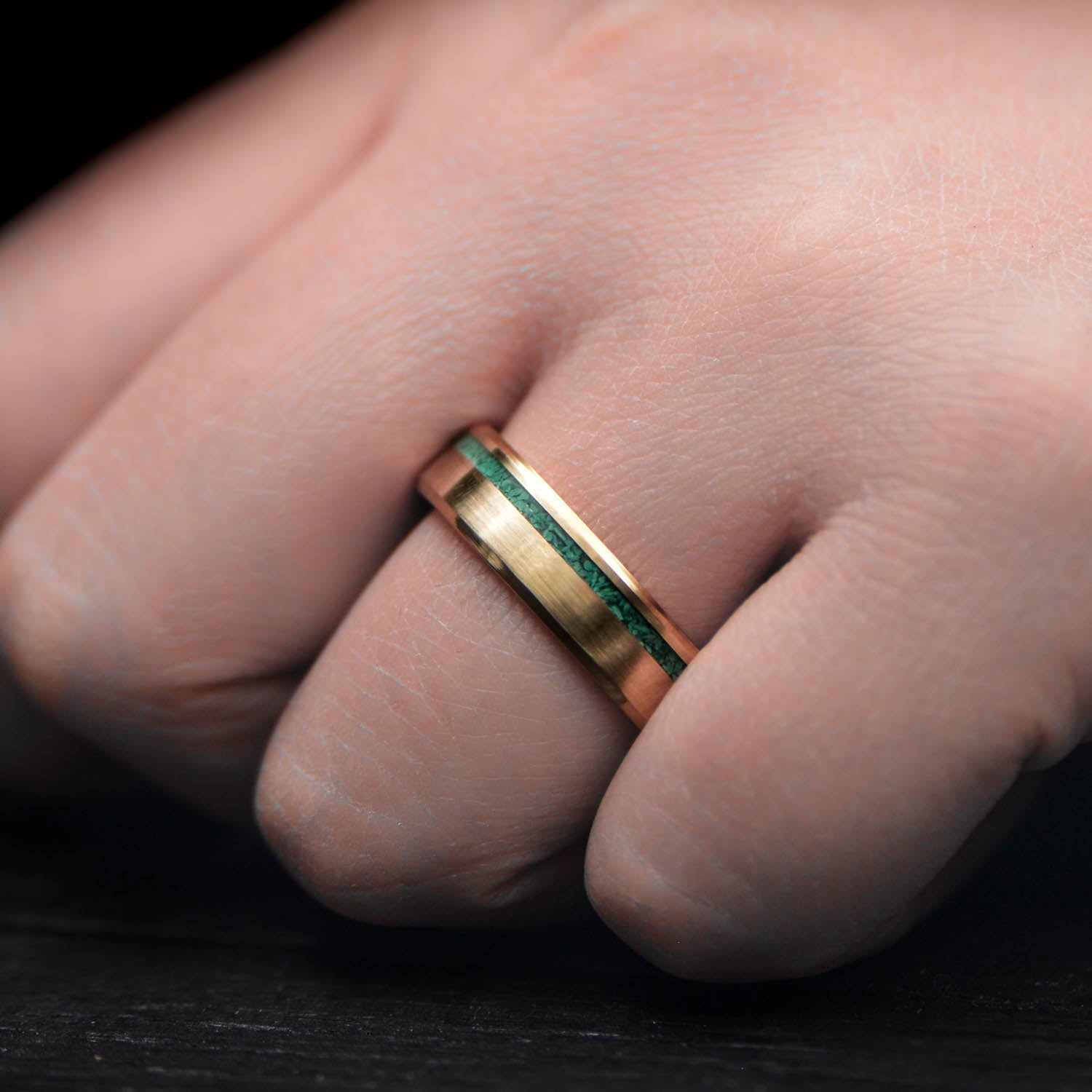 18K yellow gold wedding band with malachite inlay, 6mm mens ring, polished bevel profile, unique design, free engraving, displayed on white sea branch.