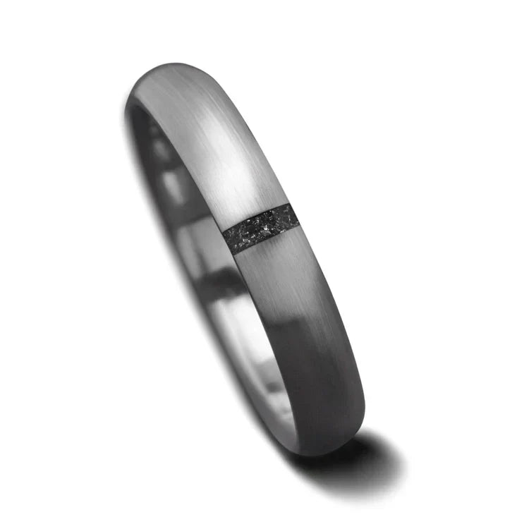 Titanium wedding band with meteorite inlay, 4mm, custom simple ring, unique wedding band, free engraving, on white background.