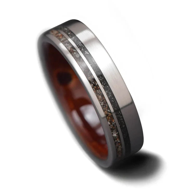 Titanium wedding band featuring crushed T-Rex fossil and Western Maple Burl wood inlays, 6mm mens ring, unique custom design, free engraving, displayed on a white background.