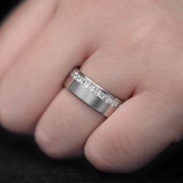 Mens 10KW brushed flat band wedding ring with half eternity princess cut stones, 7mm width, custom design, free engraving, shown on a hand.