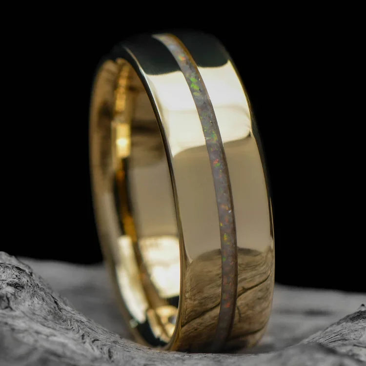 14K yellow gold mens wedding band with central pearl opal inlay and flush set diamond, 6mm polished flat profile, on a white sea branch background, free engraving available.