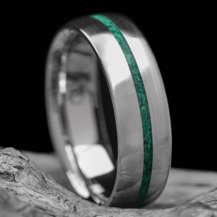 10KW mens wedding band with malachite inlay, brushed domed profile, 6mm, custom ring with free engraving, displayed on a white sea branch.
