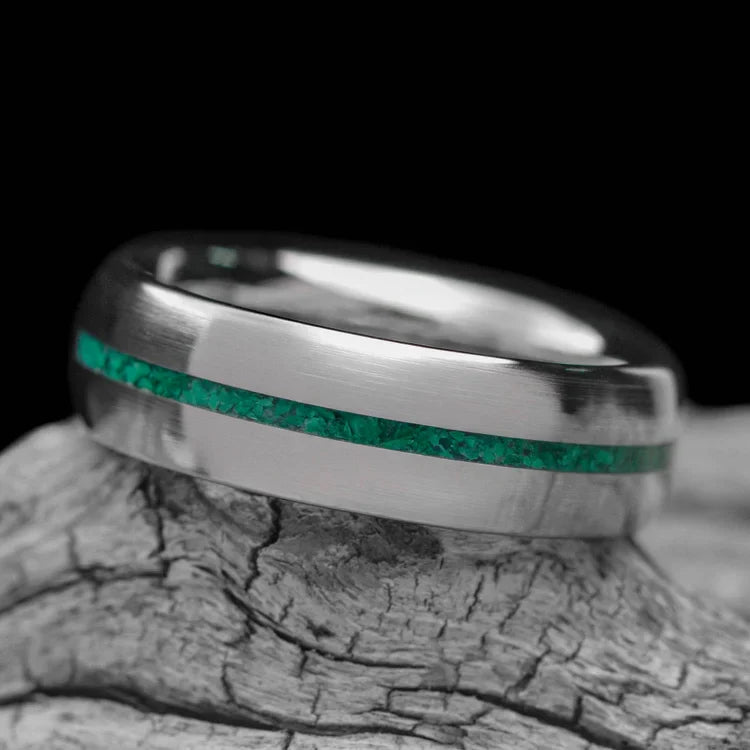 10KW mens wedding band with malachite inlay, brushed domed profile, 6mm width, unique custom ring with free engraving, displayed on a white sea branch.