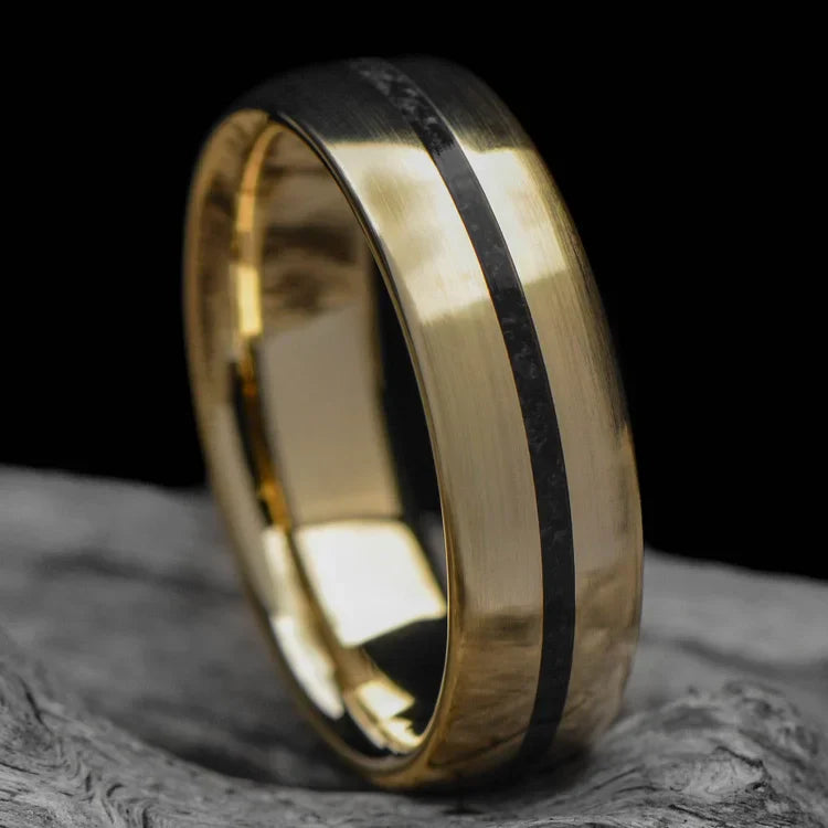 14K yellow gold mens wedding band with central black onyx inlay, brushed domed profile, 6mm width, displayed on a white sea branch, offers free engraving and unique style.