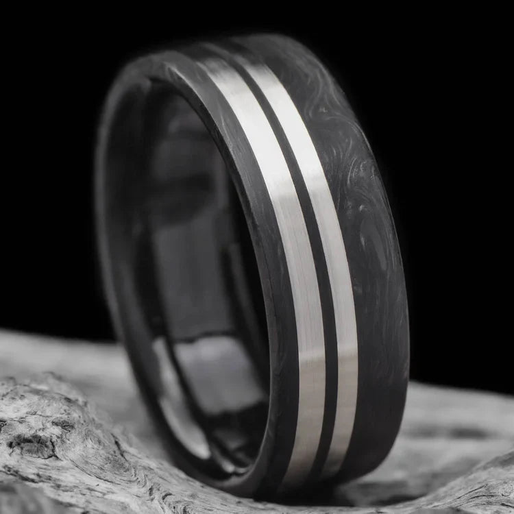 Mens wedding band, 7mm brushed flat profile, featuring dual 14KW inlays, custom forged ring with free engraving, displayed on white sea branch.