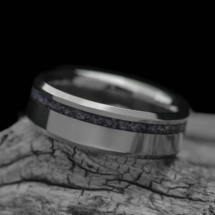 Titanium wedding band with amethyst inlay, 7mm mens ring, polished bevel profile, unique design, free engraving, displayed on white sea branch.