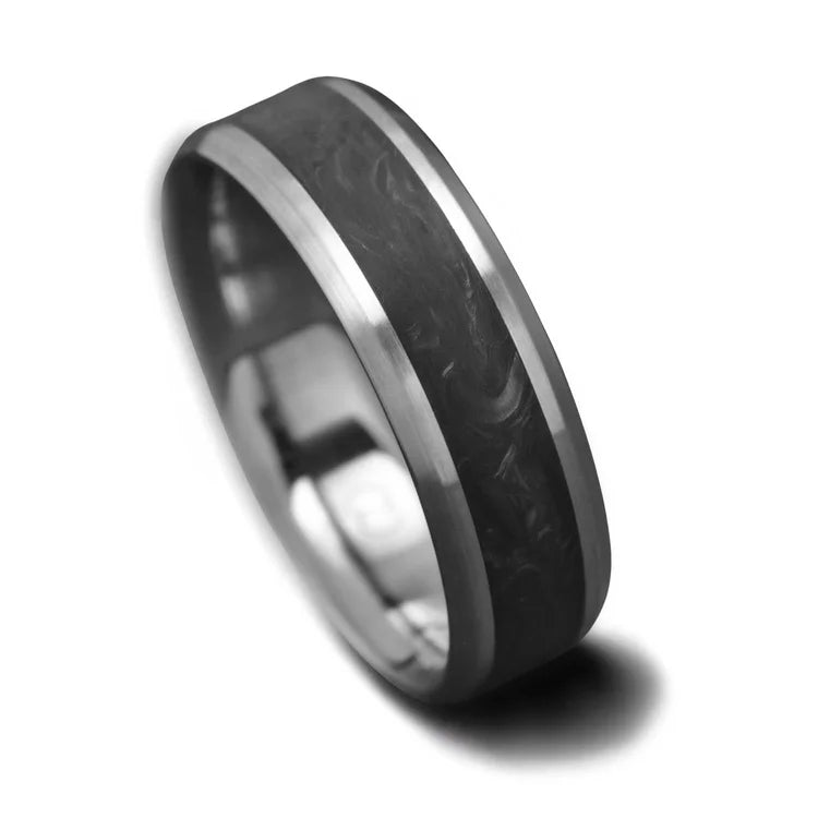 Titanium wedding band with central forged inlay, free engraving, 7mm mens wedding ring, brushed bevel profile, displayed on white sea branch.