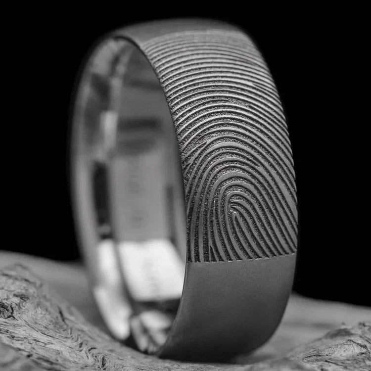 Titanium wedding band with sandblasted finish, 8mm mens domed profile ring, custom design, free engraving, displayed on a white sea branch.