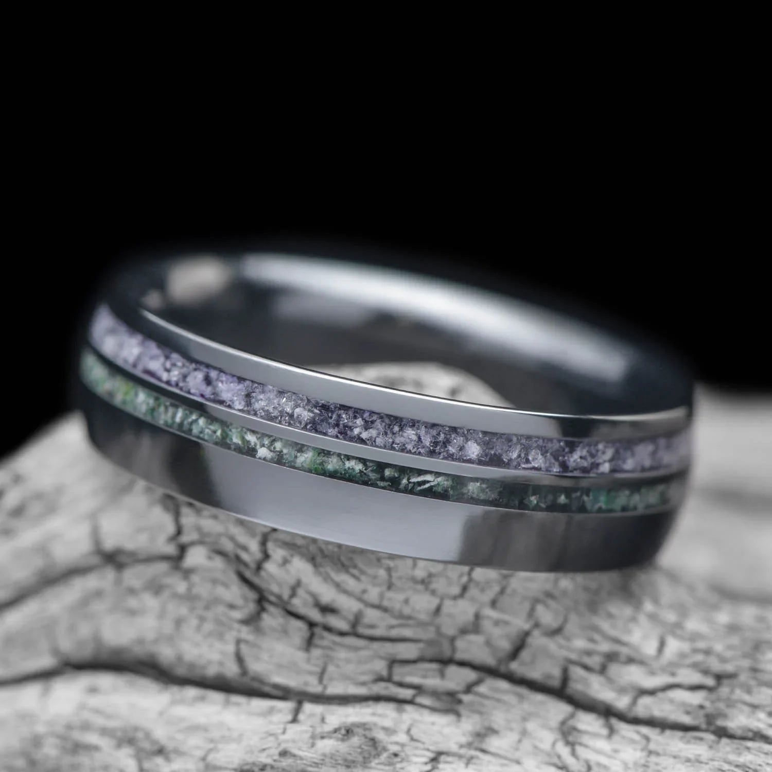 Black titanium wedding band with amethyst and moss agate inlays, 6mm mens domed polished ring, unique mens wedding band, free engraving, displayed on a white sea branch.