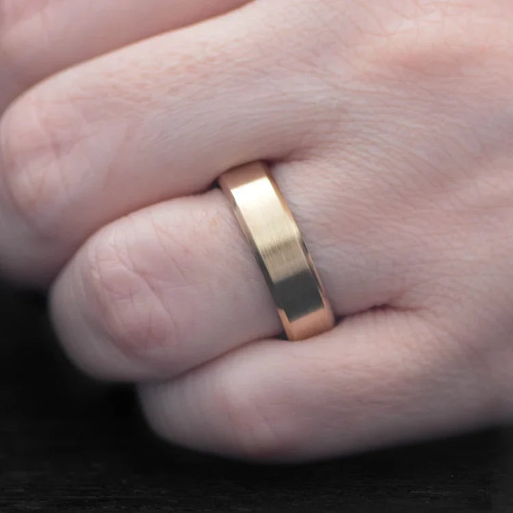 14K yellow gold mens wedding band with teak inner sleeve, featuring a brushed bevel profile, 6mm width, shown on a hand, custom ring with free engraving option.