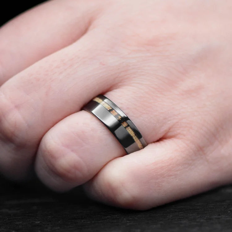 Black titanium wedding band with silver spalted birch inlay on a hand, 7mm mens custom ring with free engraving, elegant and modern mens wedding ring.