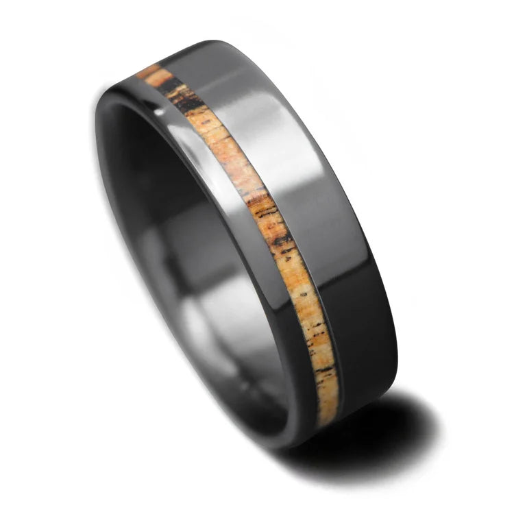 Black titanium wedding band with silver spalted birch inlay, 7mm mens ring, custom design, free engraving, elegant and modern mens wedding ring on white background.