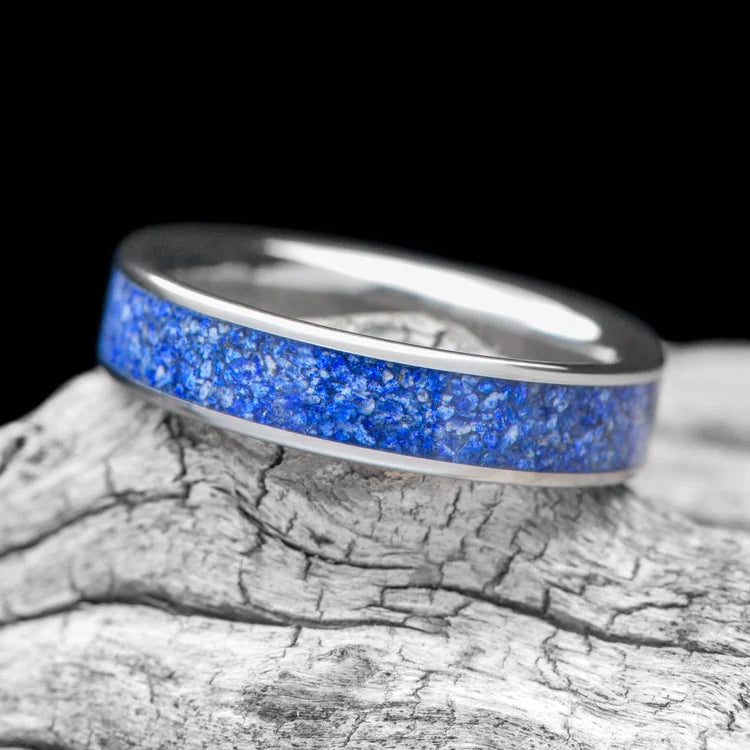 Titanium wedding band with central lapis lazuli inlay, 5mm custom simple ring, unique wedding band on white sea branch, free engraving available.