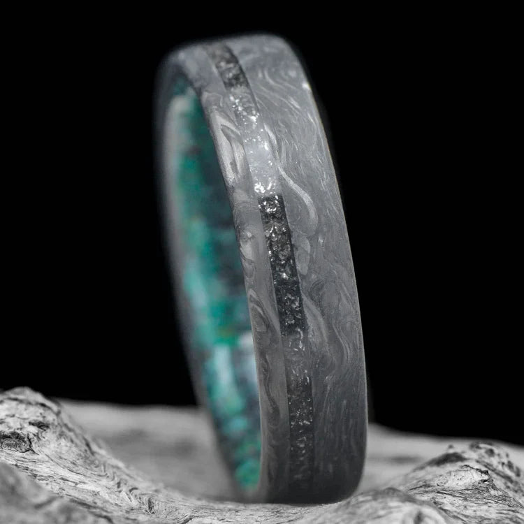 Forged wedding band with meteorite and turquoise inlay, 6mm mens ring with unique brushed flat profile, placed on a white sea branch, free engraving available.