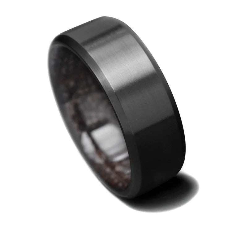 Black titanium wedding band with T-Rex inner sleeve, 8mm mens ring, unique design, free engraving option, displayed on a white background.