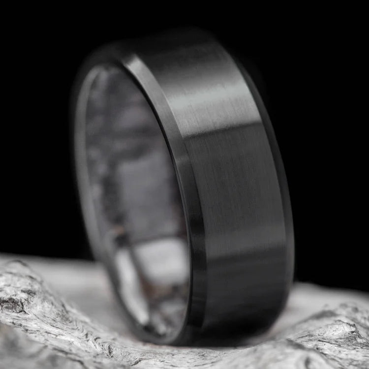 Black titanium wedding band with T-Rex inner sleeve, 8mm mens ring, unique design, free engraving option, displayed on a white background.