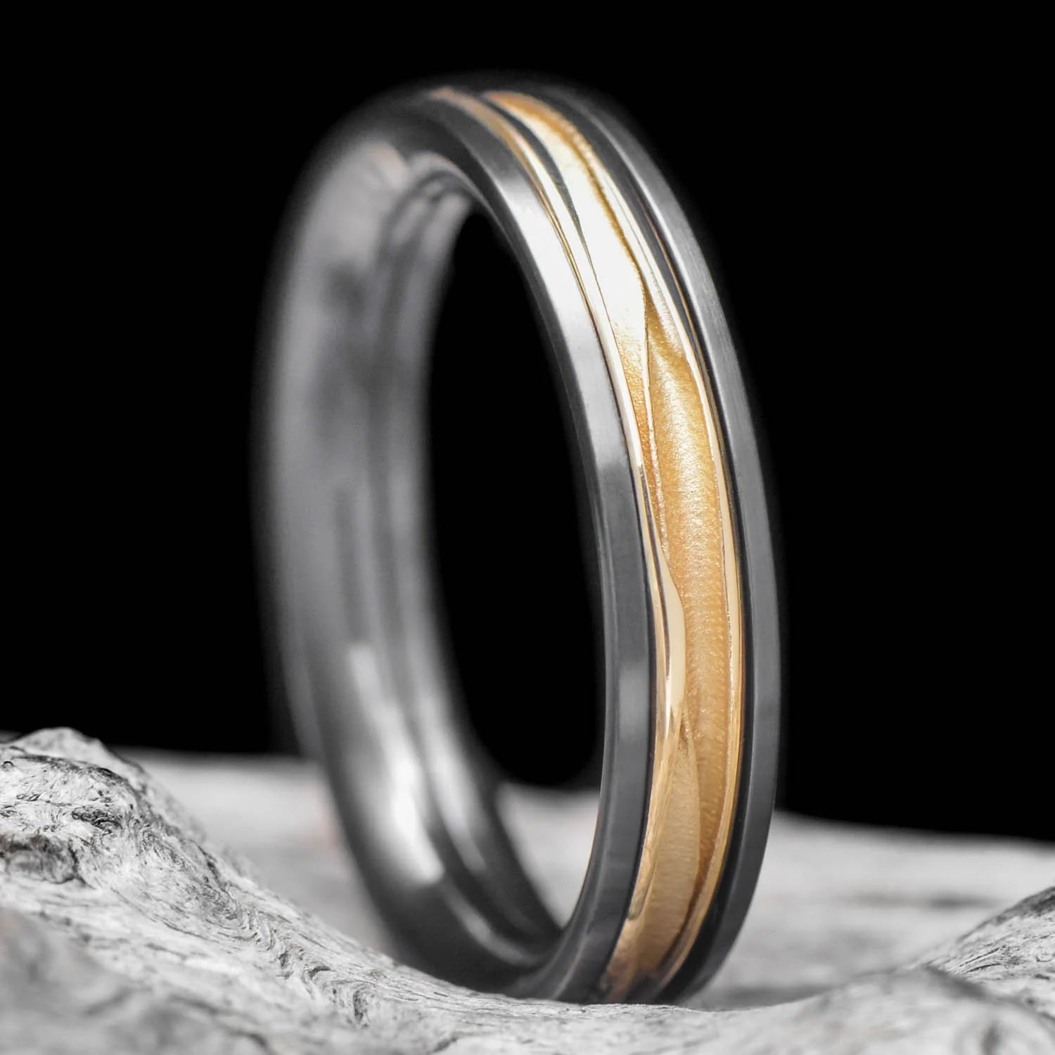 ALT text: Black Titanium Ring with 18KY Wave Central Inlay on White Sea Branch - Men's 4mm Polished Domed Profile Wedding Band with Free Engraving