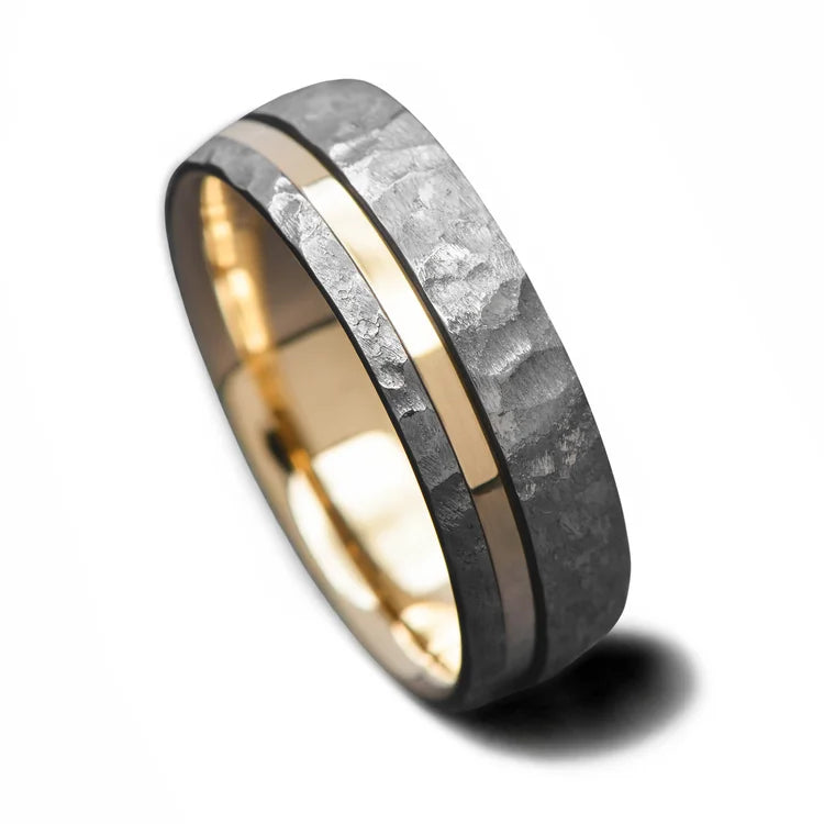 Faceted tantalum wedding band with 14K yellow gold inlay and inner sleeve, 8mm unique mens ring on white background, perfect for free engraving.