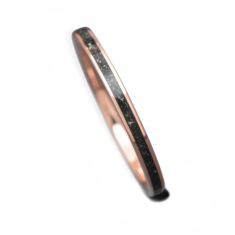 14K rose gold wedding band with central meteorite inlay, 2mm womens unique custom design, free engraving available, elegant and modern ring on a white background.