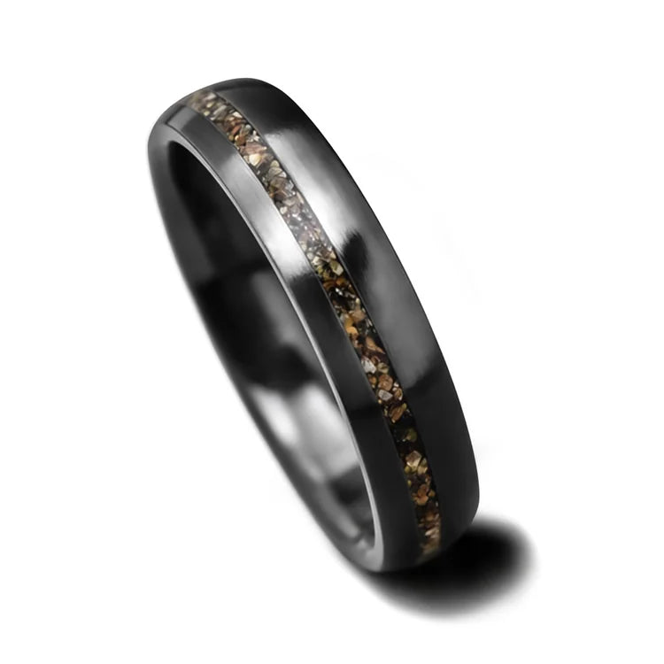 Black titanium wedding ring with crushed T-Rex inlay, featuring a brushed domed profile, 4mm width, customizable with free engraving, unique and simple design on a white background.