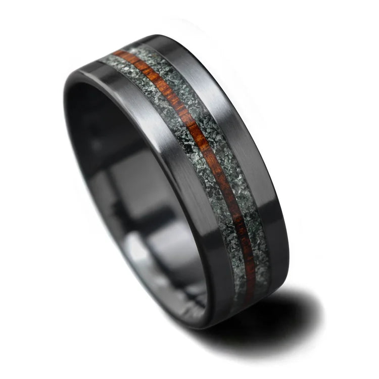 Black titanium wedding band with moss agate and central koa inlay, 8mm mens unique ring, free engraving option, displayed on a white background.