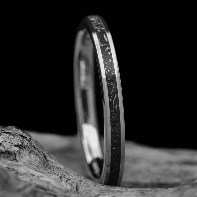 14K white gold wedding band with central meteorite inlay, womens 2mm flat brushed custom ring, laying on a white sea branch, free engraving available.