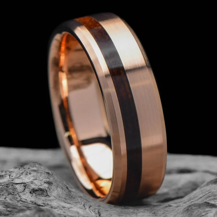 18KR wedding band with teak wood inlay, brushed bevel profile, 7mm mens ring, unique design, free engraving, displayed on white sea branch.
