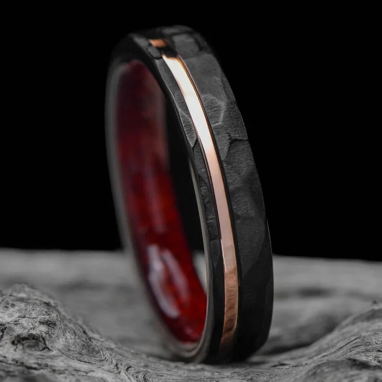 Black Titanium Wedding Band with 14K Rose Gold and Bloodwood Inlay, 4mm Custom Faceted Flat Ring, Simple Custom Wedding Band, Free Engraving, displayed on a white sea branch.