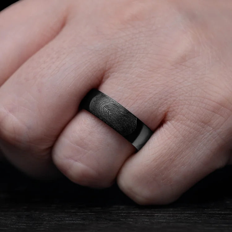 Mens Black Titanium Wedding Band with Brushed Finish and Koa Inner Sleeve, 7mm, shown on hand, unique mens ring with free engraving option.