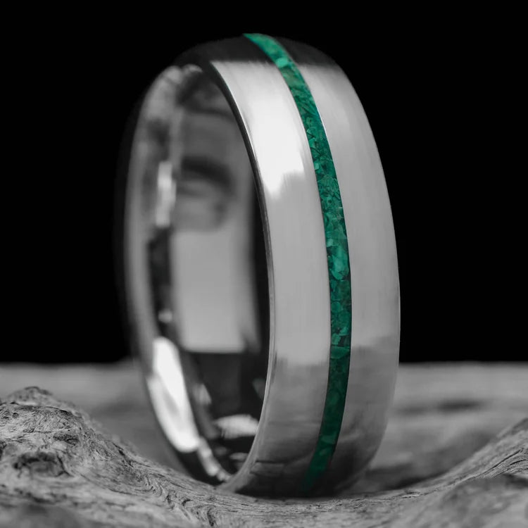 10KW mens wedding band with malachite inlay, brushed domed profile, 6mm, custom ring with free engraving, displayed on a white sea branch.