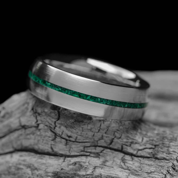 14KW mens wedding band with central malachite inlay, brushed domed custom ring, 6mm width, free engraving, displayed on a white sea branch.