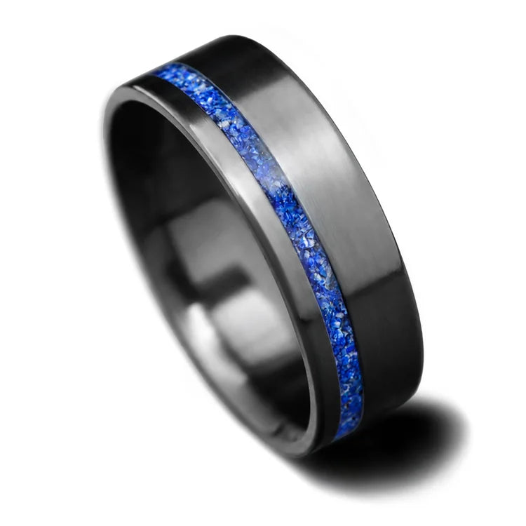 Black titanium mens wedding band with lapis lazuli inlay, 8mm brushed flat profile, featuring unique design and free engraving option, displayed on a white background.