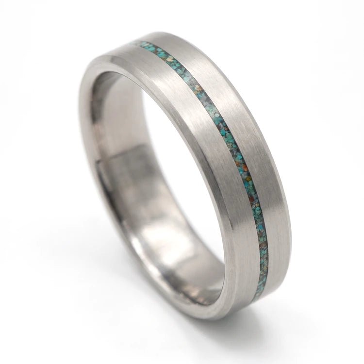 Men’s 8mm tantalum wedding band with a central turquoise inlay, brushed finish and beveled edges on a white background