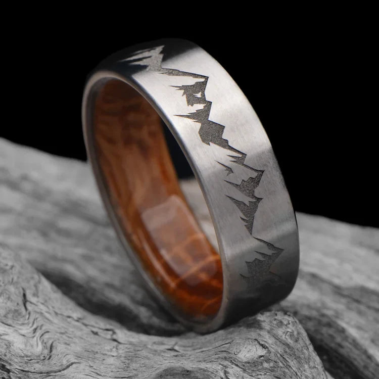 Titanium Wedding Band with Whiskey Barrel Oak Inner Sleeve, 7mm Men's Wedding Ring, Brushed Flat Profile, Free Engraving, Laying on White Sea Branch