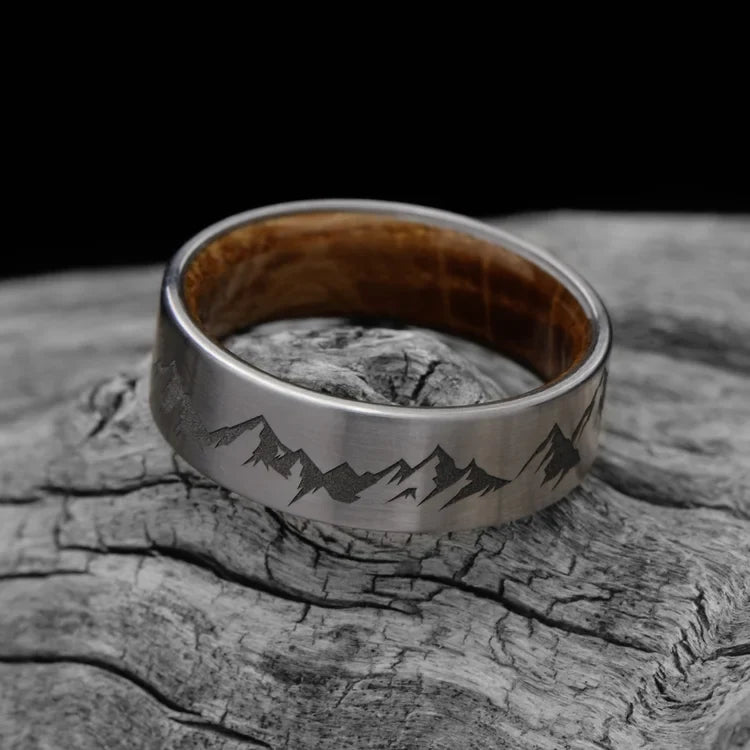 Titanium Wedding Band with Whiskey Barrel Oak Inner Sleeve, 7mm Men's Wedding Ring, Brushed Flat Profile, Free Engraving, displayed on white sea branch