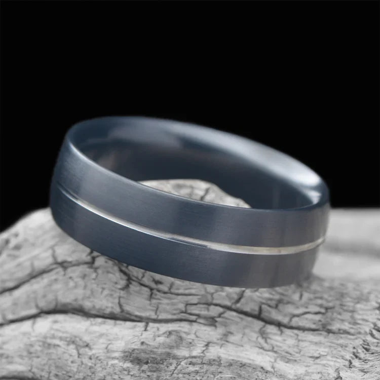 Zirconium wedding band with brushed domed profile, 8mm men's ring, custom design, free engraving, displayed on white sea branch.