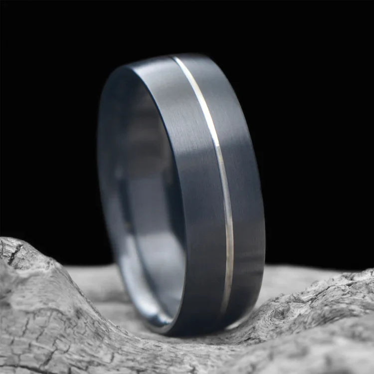 Zirconium wedding band with brushed domed profile, 8mm men's ring, custom design, free engraving, displayed on a white sea branch.