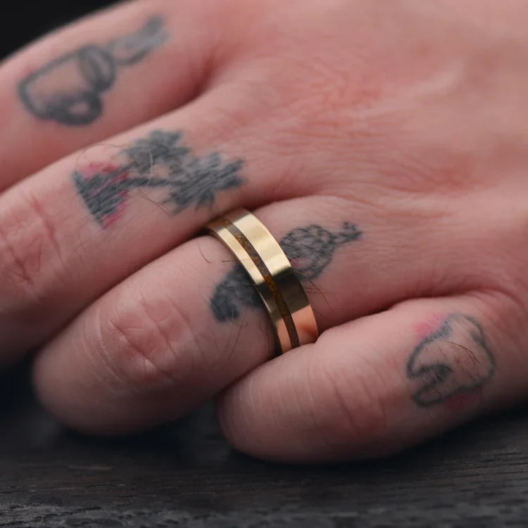 Men's 10KY gold wedding band with tiger's eye and lapis lazuli inlay, unique custom design, 6mm, free engraving, shown on hand.