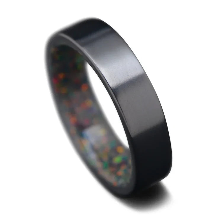 Black titanium wedding band featuring a black emerald opal inner sleeve, polished flat profile, 6mm width, mens ring, free engraving available, displayed on a white background.