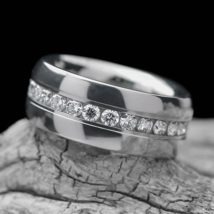 Titanium wedding band with eternity set precious stone, 8mm mens ring, polished domed profile, free engraving, displayed on a white sea branch.