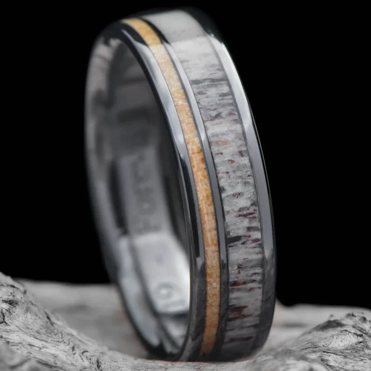 Black Titanium Wedding Band with Deer Antler and Birds Eye Maple Inlays, 6mm Mens Polished Flat Profile Ring, shown on a white sea branch, free engraving available.