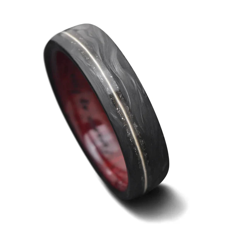 Mens 6mm matte flat profile forged wedding band with meteorite and guitar string inlay, featuring a bloodwood inner sleeve, displayed on a white background, free engraving available.